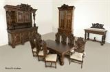 Lot 1008:  STENCEL CUSTOM CARVED OAK DINING SUITE: Profusely carved all over with many pieces bearing the heraldic crest and motto of Gdansk, Poland, 12 piece dining room suite to include dining TABLE (30 3/4'' h. x 99'' x 47 1/4''), 8 CHAIRS (2 arm 53'' h. x 27 1/4'' x 26''), court CUPBOARD with caryatid supports and figural bears (98 1/2'' h. x 98 1/2'' x 25 1/2''), SIDEBOARD (35'' h. x 63'' x 19 3/4''), CREST for sideboard (19'' h. x 49 3/4'' x 4'') and china CABINET (88 1/2'' x 50 1/2'' x 22 1/2''). Stencel custom made quality furniture is available in the UK. Est. $8000/12000**