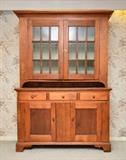 Lot 1083:  EARLY 19TH CENTURY STEP BACK CUPBOARD: Pegged construction. Est. $800/1200**