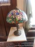 One of a pair of stained glass lamps