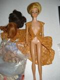 older Barbie with 3 wigs