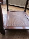 Solid wood end table, beveled glass top, caned bottom shelf