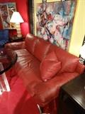 TWO RED LEATHER NATUZZI SOFAS, EACH SOLD SEPARATELY. WITH CHROME FEET