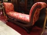 CARVED WOOD BENCH WITH CURVED ARMS, RED AND GOLD UPHOLSTERY