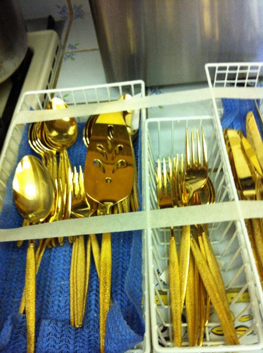                                 set of gold flatware