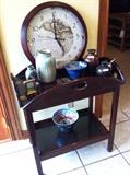 assortment of decorative items on butler's tray table 