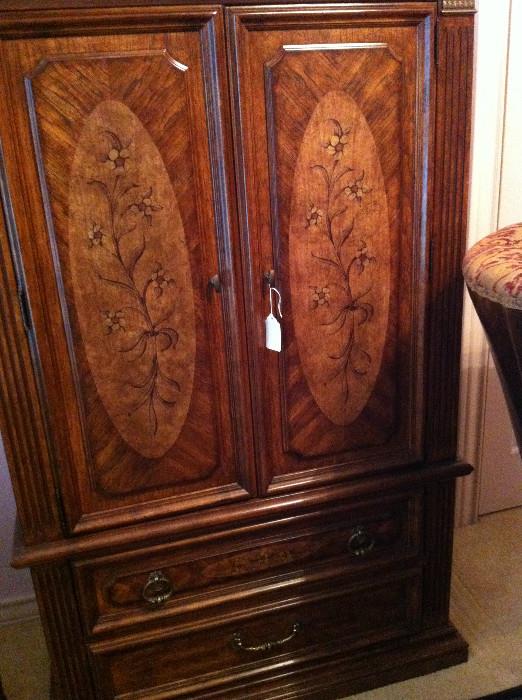                  armoire with decorative panels