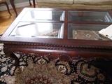 Ornate carved cherry coffee table w/ glass