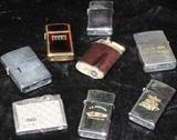 Collection of vintage Cigarette lighters: 6 Zippos, Center is a Ronson and the lower left is Continental/Japan