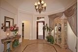The Foyer' Entrance View with Metropolitan Marble Top Crackle Console Table and Crystal Urn Lamps and BEL Furniture White Wash French Curio Cabinet