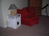 This is a piece that goes with the red sectional in a photo to follow
