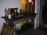 there is a pair of these iron and marble tables. There is a slab of marble on the top and bottom shelf. They are old and stunning.