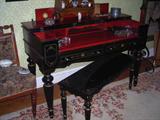desk is inlaid with mother of pearl with matching bench