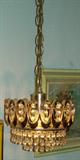 This is one of a pair of lovely small chandeliers hanging in the master bedroom.