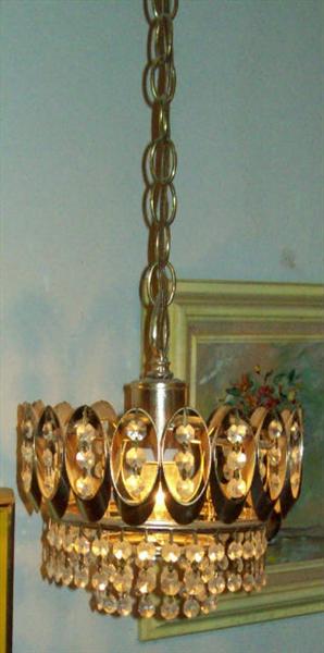 This is one of a pair of lovely small chandeliers hanging in the master bedroom.
