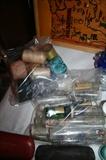 Medicine bottles & sewing items by sewing machine upstairs