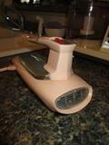 Retro pink hand mixer (reminds me of cars from that era)