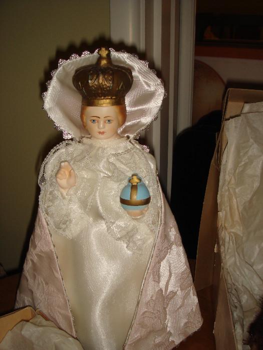 chalk religious doll Infant Jesus of Prague with various outfits 