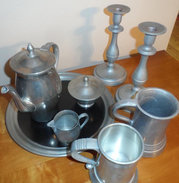 Pewter tea set, steins, and candle holders.