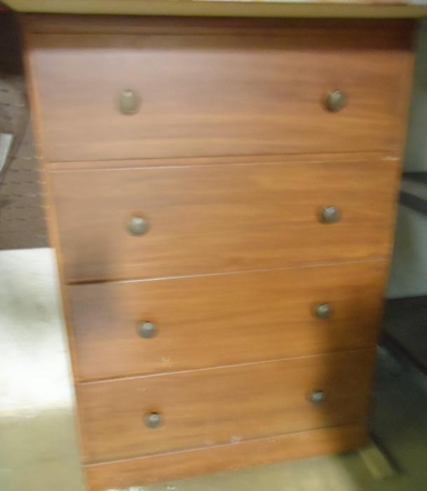Old chest but has an odd top attached in work room.