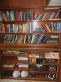 Vintage Books in Pharmacy cabinets. We took glass panels sliding doors off..to shop better.