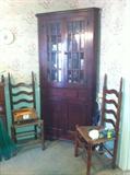 Early vintage cherry corner cabinet. 6 Rush-bottom ladder back chairs. 