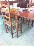 Early vintage cherry drop leaf table.