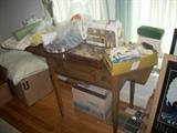 sewing machine with lots of sewing items and accessories