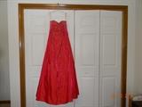 Here is a "Precious Formals", cherry red, sequin and beaded, strapless formal gown. It has a zippered back. There are no obvious flaws. Size is 14.