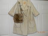 Retro! Cream colored, Borgana with Filene’s Label Faux Fur Coat. 1/2 length sleeve. Interior lining needs some restitching. Size appears large or x-large. Suggest cleaning. Tag reads, “Clean with fur coat method.” AND Rabbit Fur Purse. No interior label in purse.