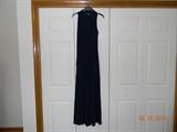 Long, sleeveless, Navy Blue, V-neck dress with attached, fringed scarf.
Stretchy knit. Appears size small. Tag previously removed. Rehemming is necessary.
