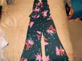 Awesome Retro Stretch Polyester Outfit. 3 button Halter peplum top
(late 60’s -- early 70’s) with full length large bell bottoms. Flower design.
Appears size small. No visible defects. Tags previously cut out.