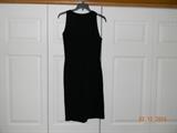 A Little Black Dress! Sports and Country Cloth. Lord and Taylor Fifth Avenue.
Tag reads size 12, but looks MUCH smaller. Low backed. Fitted. Darts. Stretchy.
Original stitching. One inch pull in back stitching. Visible in picture.
No other obvious defects.