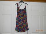Multi-colored print sundress with beaded belt. Some seam work needed.
Smaller size but can be let out about 1/2 inch in bust.