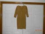“Peter Picard” 3/4 length sleeve, golden brown, fitted sweater dress. Nice knit detail at cuffs, collar and hem. Button front.