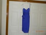 “A. J. BARI” Ceylon sapphire blue, 100% silk, strapless dress.
Falls slightly below the knee. Beautiful bodice wrap detail.
Rhinestone at bow. Zipper back. Size 10.