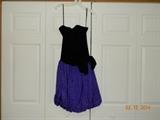 Retro 80’s dress! “Positively Ellyn” Black velvet and purple (with black
flocked polka dot) strapless dress. Boned top and bubble bottom.
Elasticized back and back zipper. Appears knee length. Size 8.