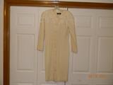 Off-white/ cream color Gillian dress. Eight buttons with snaps between the top three buttons. Princess seaming in both front and back. Mid-calf length. The lining is in good shape. There is a small stain on the right hip. This would go
perfect with ivory silk sheath. 100% Wool. Size 10.