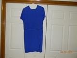 “Shomi” Royal Blue, 100 % silk, short sleeve dress. Pleated ruffle
on skirt. Knee length. Shoulder pads and back zipper. Size 8.
