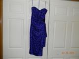 “A. J. BARI” Indigo leopard print dress with black beaded applique. Dress is 100% silk and strapless. Ruffly down left side. Back zipper. Size 8.