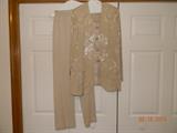 Wheat colored pant suit manufactured for R & M Richards. Subtle sunflower pattern on jacket. Four metal tone frog closures on vest. Vest attached to jacket. Elastic waist pants. Size 10.