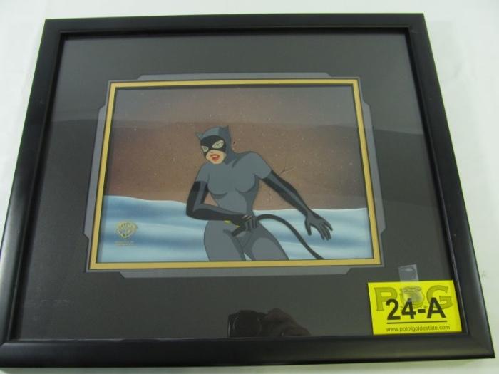 Lot#:	24a
Description:	Art, "Cat Scratch Fever" Batman Cel
Terrific Warner Bros. Batman: The Animated Series "Cat Scratch Fever" cel. The print depicts Catwoman holding a whip in front of a wall. On the back of the frame is the Warner Bros. Certificate of Authenticity signed by Steve Felton (Director of Warner Bros. Animation Art) with the Warner Bros. ID# 43130. The cel is professionally framed and measures 16 ¾" tall X 19 ¾" wide (frame to frame). 
From Wikipedia: "Batman: The Animated Series is an American animated television series based on the DC Comics superhero Batman. The series was produced by Warner Bros. Animation and originally aired on the Fox Network from September 5, 1992 to September 15, 1995. The visual style of the series, dubbed "Dark Deco," was based on the film noir artwork of producer and artist Bruce Timm. The series was widely praised for its thematic complexity, dark tone, artistic quality, and faithfulness to its title character's crime-fighting origins. The s