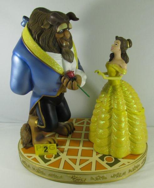 Lot#:	2
Description:	Art, Disney 4 pc "Beauty and the Beast" Statue
Fantastic HUGE fully sculpted Beauty and the Beast 4 piece sculpture. Sold exclusively at The Magic of Disney Animation Stores at Disney theme parks, this statue features Belle and the Beast sharing a special moment on the ballroom floor together. Beast is holding the Enchanted Rose behind his back while Belle is holding her hands out to him. The 4 piece set includes Belle, Beast, the Enchanted Rose and the Ballroom floor base. Each is sculpted out of resin, hand painted with glitter accents with felt bottoms to protect the finish. Marked on the bottom of the base “The Art of Disney Theme Parks”. It is in excellent condition free from damage or repairs. Statue measures: Belle 18'' tall, Beast 21'' tall, Base 16 1/2'' wide x 23 1/2'' long x 3'' tall, Overall height 24” tall. 
Tag Word: children’s, fairytale, folktale kids, toy, Walt
For another Beauty and the Beast statuette see lot # 313