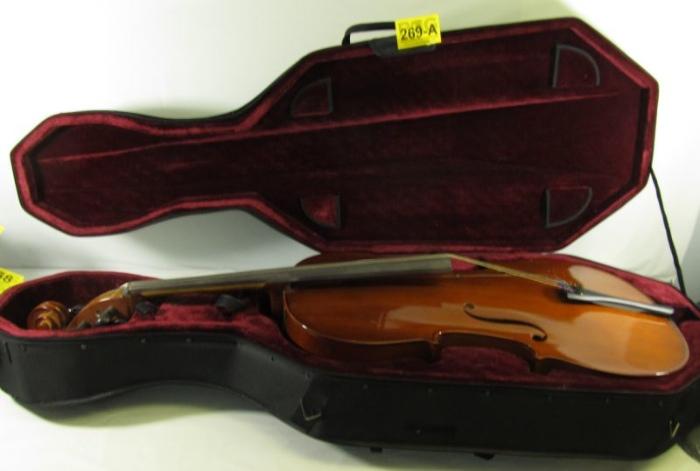 Lot#:	269a
Description:	Large Handmade 4/4 Cello Instrument w/ Case
Wonderful large handmade Cello with case. This bowed string instrument is a full size 4/4, and of high quality. It has a gorgeous glossy caramel stained hour-glass shaped spruce top with maple back, highlighted with black / ebonized colored fingerboard and tailpiece. In excellent pre-owned condition with some minor surface scratches. This cello is missing the bow; but could easily be replaced. Great for a band student, or casual player; it comes in a protective black nylon covered hard case; which is in great condition and lined with burgundy velvet. Cello measures 50” long, Case measures 55” long.
From the internet: “The cello is used as a solo instrument, as well as in chamber music ensembles, string orchestras, and as a member of the string section of symphony orchestras. It is the second-largest bowed string instrument in the modern symphony orchestra, the double bass being the largest.”
Tag Words: music, fiddle, s