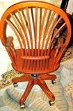 Pretty Oak Office Chair (Mennonite / Amish) with rich finish, nicely carved arms, spindled supports and wheat shock style spindled back, 4 nicely carved legs with caster mounted feet
