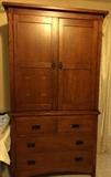 Bassett Grove Park oak mission style entertainment armoire with TV shelf and four drawers in excellent condition.
