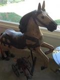 Large carved horse on stand.