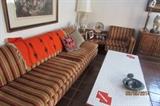 Cool sofa with orange/ brown striped cover