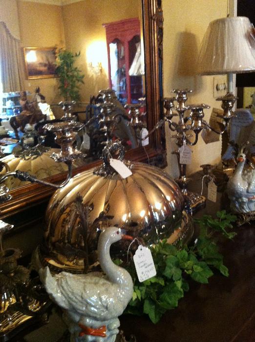              silver pieces atop dining room sideboard