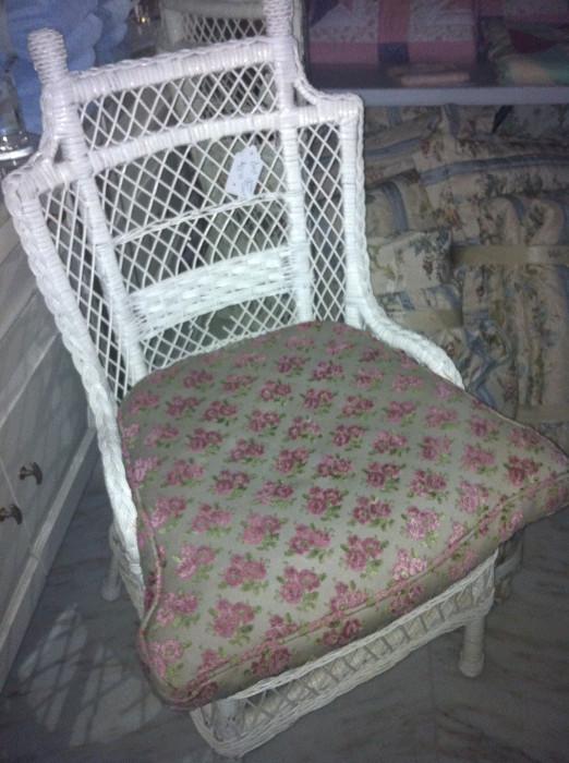                     white wicker chair with cushion