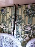              twin beds (wicker settee & chair in front)